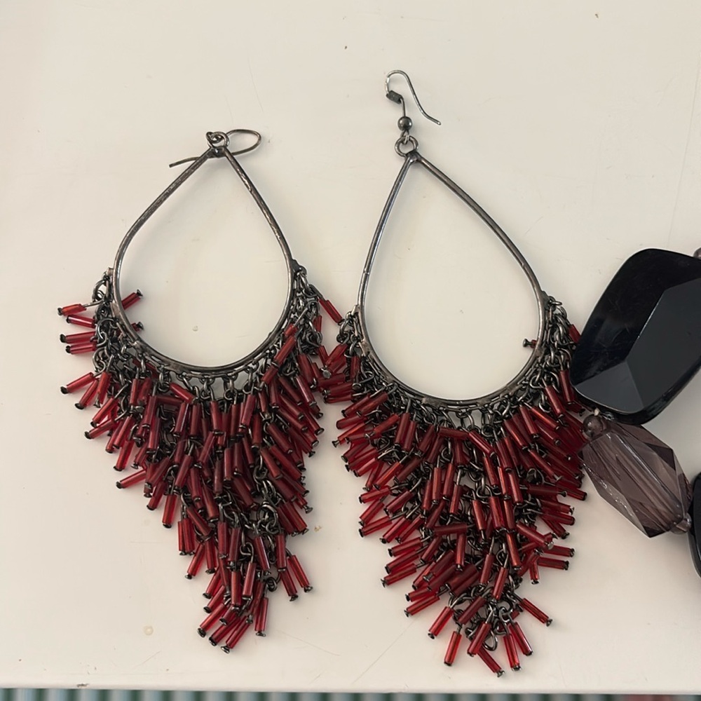 Two pairs of earrings and a bracelet.